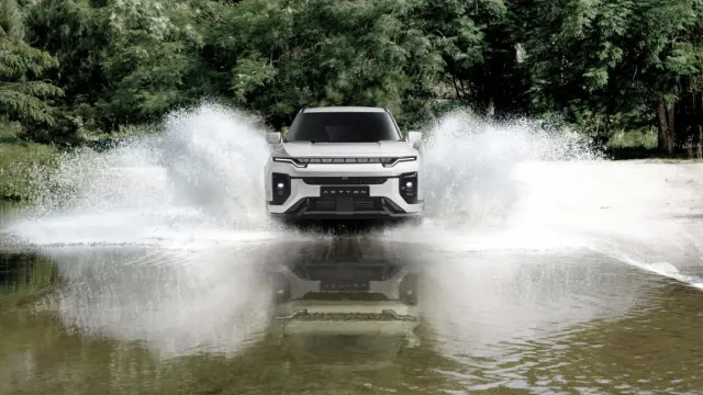 car testing specialist four wheel drive down the road in the forest to test the performance of the car